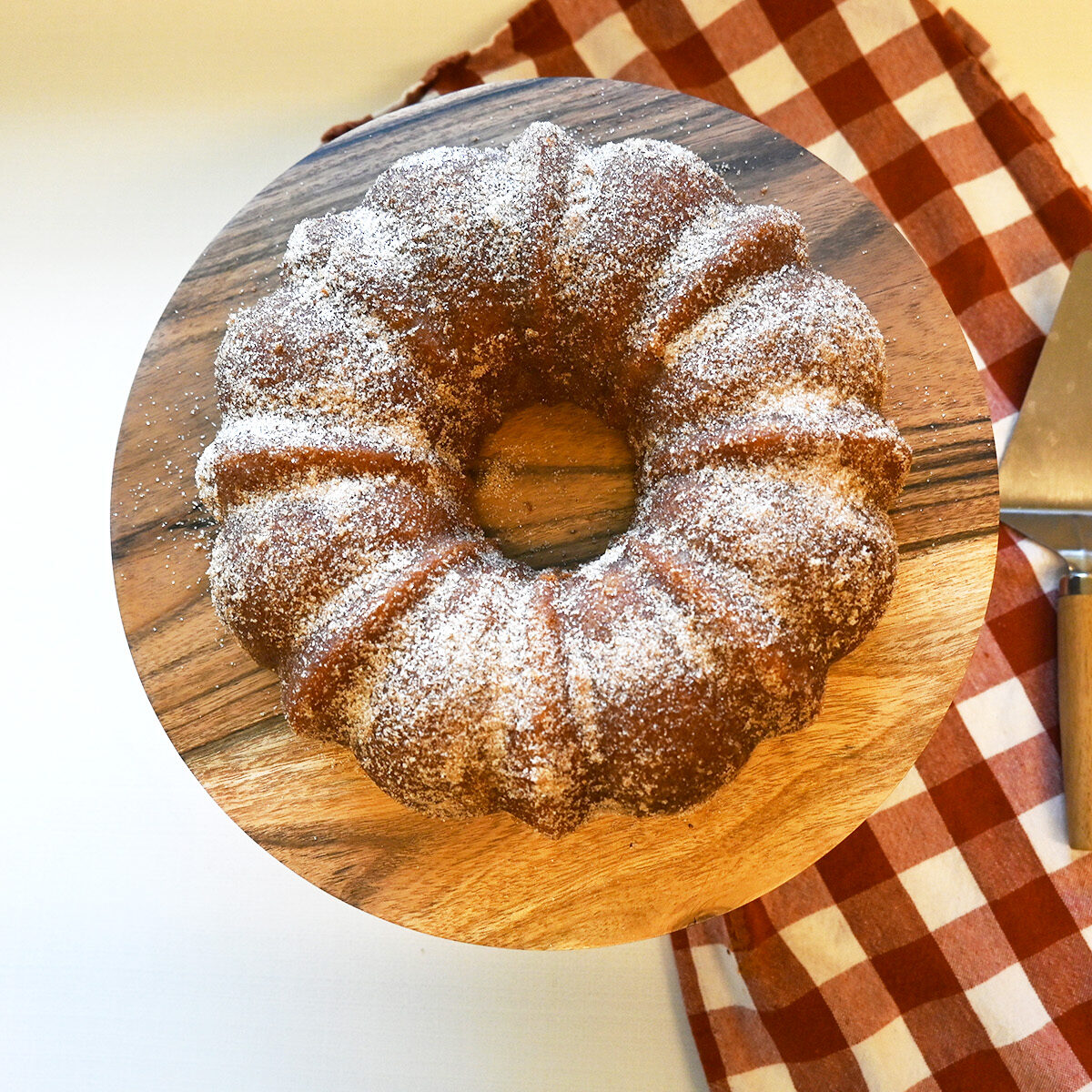 Conquer your donut cravings with this brown butter and cinnamon-sugar coated cake, perfect for sharing at any Autumn gathering. 