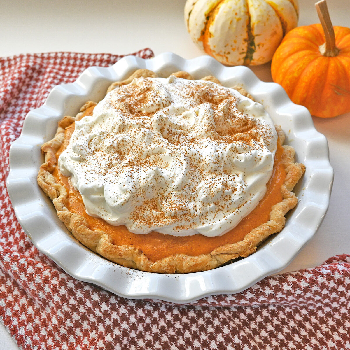 A light as air take on pumpkin pie with freshly whipped cream is made that much better using Prairie Farms whole milk.